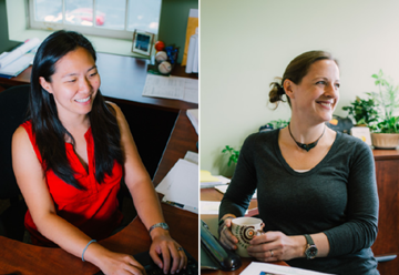 Image of Diana looking at her computer on left & Melissa looking up from her desk on right